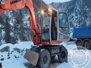 bagri na kolesih liebherr a 309 litronic