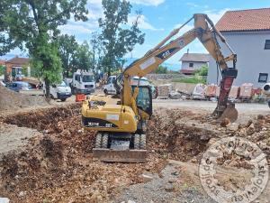 bagri na kolesih caterpillar m315c