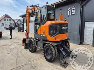 Bagri na kolesih, Ostali DX100W-7 - POWERTILT - 4X ŽLICE - STABILIZATORJI